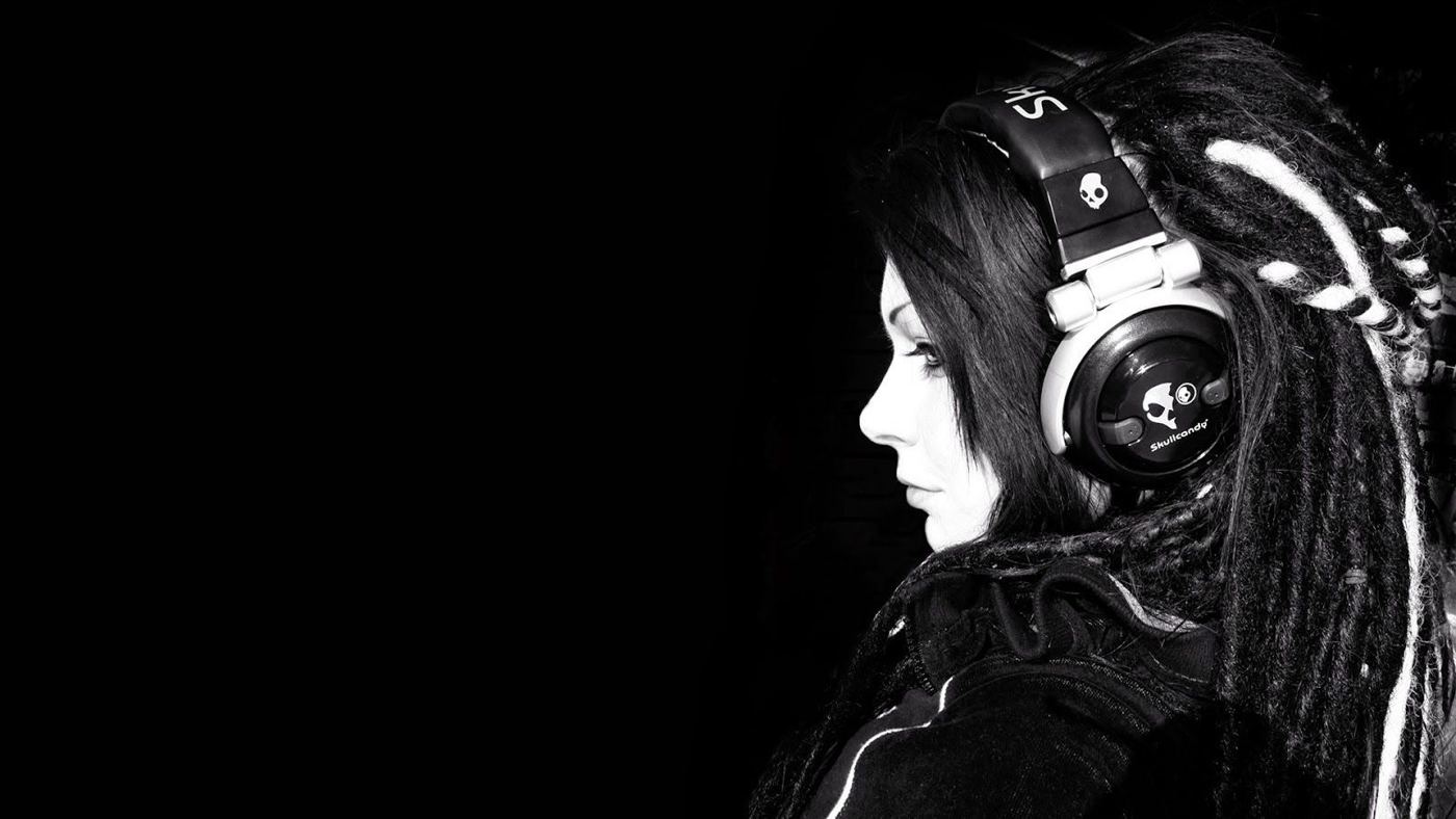 Listener with headphones checking a phone