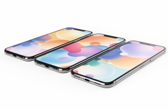 Identical modern smartphones on a white surface